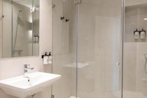 Et badeværelse på Uma Suites O'Donnell