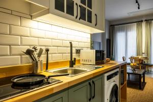 a kitchen with a sink and a microwave at Respiro Rooms in Istanbul +60 photos