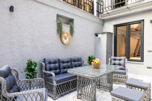 an outdoor patio with chairs and a table with a table at Respiro Rooms in Istanbul