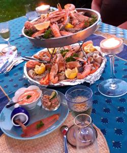 a table with two trays of seafood on it at Les Ondines in Estréelles +17 photos