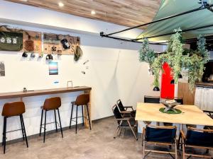 a restaurant with two tables and a bar at HOTEL ERENOA - Vacation STAY 61067v in Nagoya