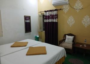 Ένα ή περισσότερα κρεβάτια σε δωμάτιο στο International Guest House