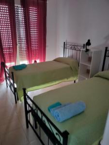 Ένα ή περισσότερα κρεβάτια σε δωμάτιο στο Vista mare a Sanremo