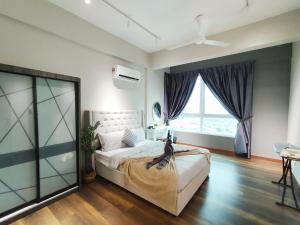 a bedroom with a bed and a large window at Ipoh D Festivo Suites 6-10pax 10mins to Sunway Tambun by IWH in Ipoh +69 photos