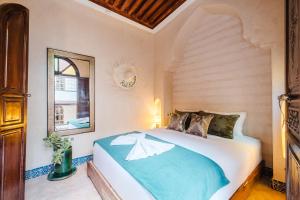 Voodi või voodid majutusasutuse Riad Cozy Marrakech, Shared Pool with 3 Rooms toas