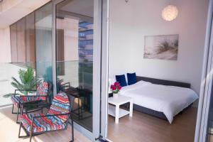 Ένα ή περισσότερα κρεβάτια σε δωμάτιο στο Luxury Jr. 1BR in Mayan Yas Island