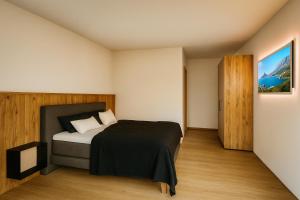 Ένα ή περισσότερα κρεβάτια σε δωμάτιο στο ELEVATE Apartment - Opening December 2025