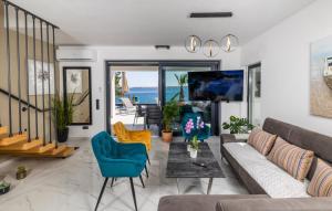 a living room with a couch and a table at Villa Palazzo Maestral beachfront by Villas Guide in Viniština