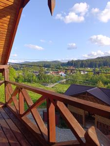 a view from the balcony of a cabin at Котедж Арніка з Чаном in Vorokhta