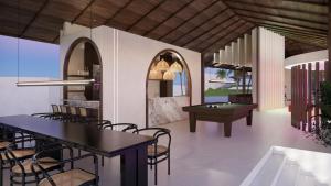 TV a/nebo společenská místnost v ubytování Maha Party Resort Canggu