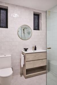a bathroom with a sink and a mirror at The Avenue in Launceston +15 photos