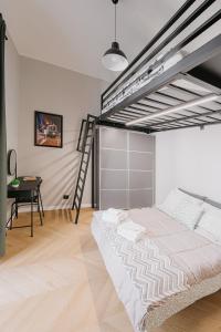 a bedroom with a loft bed and a desk at Mole Turin Suite in Turin