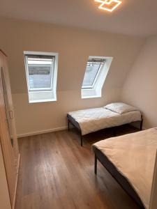 Postel nebo postele na pokoji v ubytování Erics Gästehaus