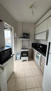 Køkken eller tekøkken på Edifício orion Guaratuba