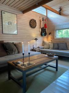 a living room with a table with candles on it at Wonderful Family Vacation Home in Ågerup