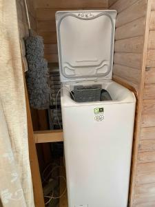a small white refrigerator in a small room at Wonderful Family Vacation Home in Ågerup +34 photos