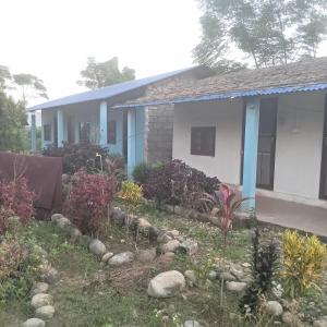 a house with a garden in front of it at Ecopark Homestay in Bharatpur