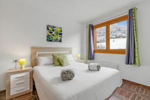 a bedroom with two beds and a window at Family-Friendly Andorra Accommodation - Happy Rentals in El Tarter