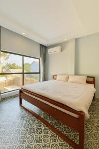 Postel nebo postele na pokoji v ubytování Canopy Pool Villa + 18 fotografií