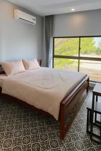 Postel nebo postele na pokoji v ubytování Canopy Pool Villa