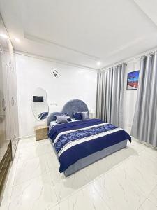 Ένα ή περισσότερα κρεβάτια σε δωμάτιο στο Merakie Homes