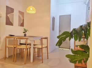 a dining room with a table and chairs at Pierside Inn in Cebu City