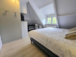 Ένα ή περισσότερα κρεβάτια σε δωμάτιο στο Strandvilla Kamperland +28 φωτογραφίες