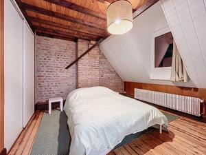 En eller flere senge i et værelse på Duplex de la place de Bergues