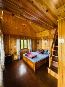 Ένα ή περισσότερα κρεβάτια σε δωμάτιο στο Himalayas Hostel & Homestay