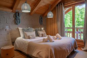 Ένα ή περισσότερα κρεβάτια σε δωμάτιο στο Chalet Belliou