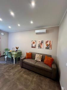 a living room with a couch and a table at Marine Case Vacanze in Palermo +36 photos