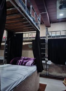 a couple of bunk beds in a room at Manya hotel and dormitory in Jhānsi +12 photos