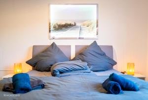 Ένα ή περισσότερα κρεβάτια σε δωμάτιο στο Gemütliche und komfortable Wohnung für 6 P