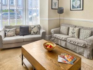 a living room with a couch and a coffee table at Bora House in Newquay +20 photos