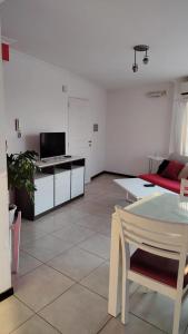 a living room with a couch and a table at Apartamento 4 de Enero in Santa Fe