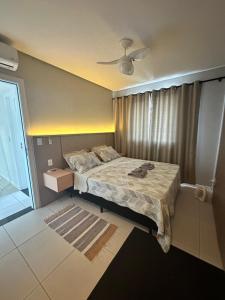 Ένα ή περισσότερα κρεβάτια σε δωμάτιο στο Apto lindo e completo com piscina em Itajai +34 φωτογραφίες