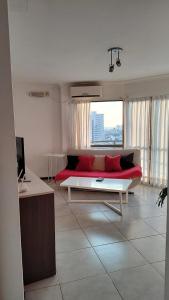 Μια τηλεόραση ή/και κέντρο ψυχαγωγίας στο Apartamento 4 de Enero