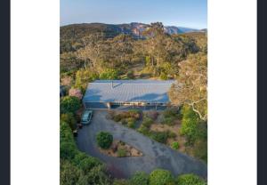 an aerial view of a house in the mountains at Govetts Leap lookout cottage with sauna in Blackheath