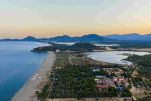 an aerial view of a beach and the ocean at 4 Mori Family Village - Villaggio per Famiglie in Muravera