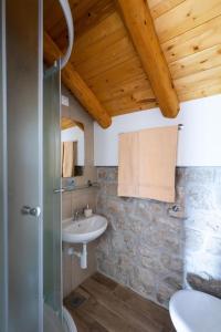a bathroom with a sink and a shower at Luciana by Vintage Travel in Mihanići +33 photos