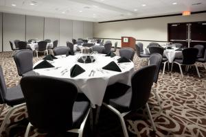 a conference room with tables and chairs in it at Holiday Inn San Antonio North Stone Oak Area by IHG-Newly Renovated in San Antonio +50 photos
