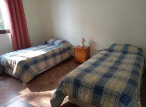 Ένα ή περισσότερα κρεβάτια σε δωμάτιο στο Lindo y cómodo departamento en Maitencillo, Chile