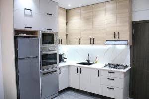 Kuchyň nebo kuchyňský kout v ubytování Nouvel appartement moderne