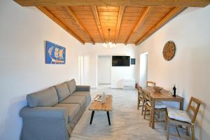 a living room with a couch and a table at Zoe's and Leonard's Houses in Hydra