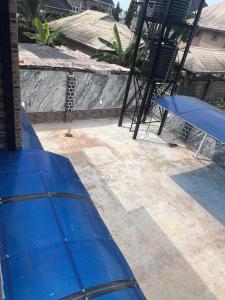 a blue raft sitting on top of a patio at GG suites and Apartments in Owerri