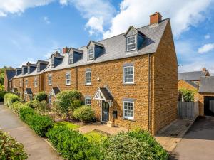 a large brick house with a gray roof at Pass the Keys Former Show Home 6 min walk to Deddington in Deddington