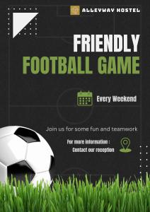 a soccer ball is sitting on the grass at Alleyway Hostel in Ho Chi Minh City