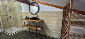 a bathroom with a sink and a mirror at Casa La Fuencisla in Castiltierra +17 photos