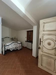 Ένα ή περισσότερα κρεβάτια σε δωμάτιο στο Emozioni Di Campagna