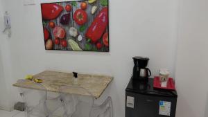 a painting of fruits and vegetables is on the wall at Vista da praça Castro Alves in Salvador +4 photos